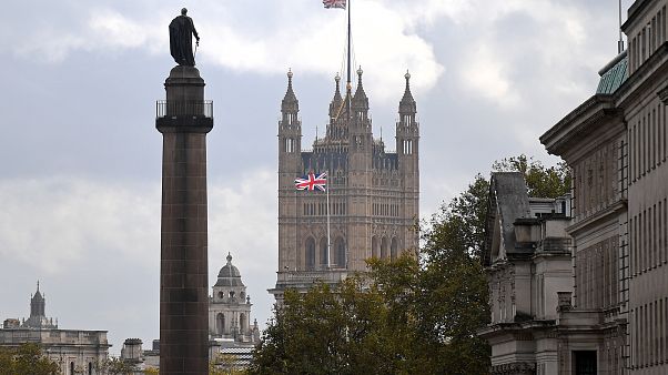 A Union flag flies atop the the Victoria Tower at Britain's Houses of Parliament, incorporating the House of Lords and the House of Commons, in London on October 20, 2020. A Union flag flies atop the the Victoria Tower at Britain's Houses of Parliament, incorporating the House of Lords and the House of Commons, in London on October 20, 2020.