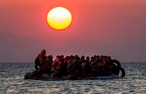 In this file photo taken on Aug. 13, 2015, migrants on a dinghy approach the southeastern island of Kos, Greece