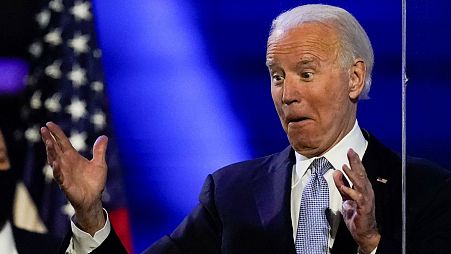 President-elect Joe Biden reacts as he stands on stage after speaking on Saturday.