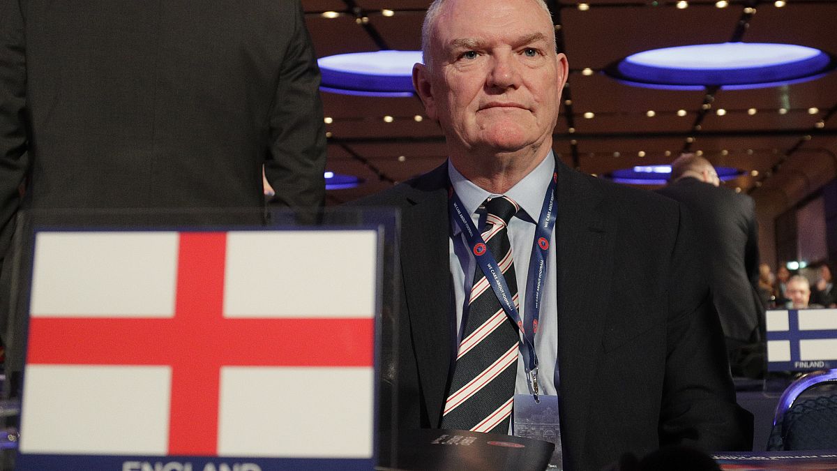 In this file photo dated Thursday, Feb. 7, 2019, England's FA Chairman Greg Clarke poses for photographers as he arrives on the occasion of the 43rd UEFA congress in Rome. 