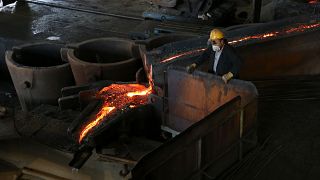 Employees work at the smelting ferrochrome plant of Elbasan, east of capital Tirana