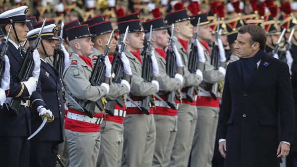 French President Emmanuel Macron reviews the troops as he inaugurates a memorial for soldiers fallen in foreign conflicts, Monday Nov. 11, 2019 in Paris. French President Emmanuel Macron reviews the troops as he inaugurates a memorial for soldiers fallen in foreign conflicts, Monday Nov. 11, 2019 in Paris.