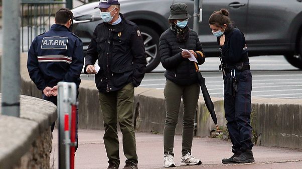 Police officers check documents to ensure that confinement measures due to the coronavirus are upheld in Saint Jean de Luz on Nov.3, 2020. Police officers check documents to ensure that confinement measures due to the coronavirus are upheld in Saint Jean de Luz on Nov.3, 2020.