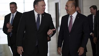 Turkey's Foreign Minister Mevlut Cavusoglu, right, and U.S. Secretary of State Mike Pompeo 