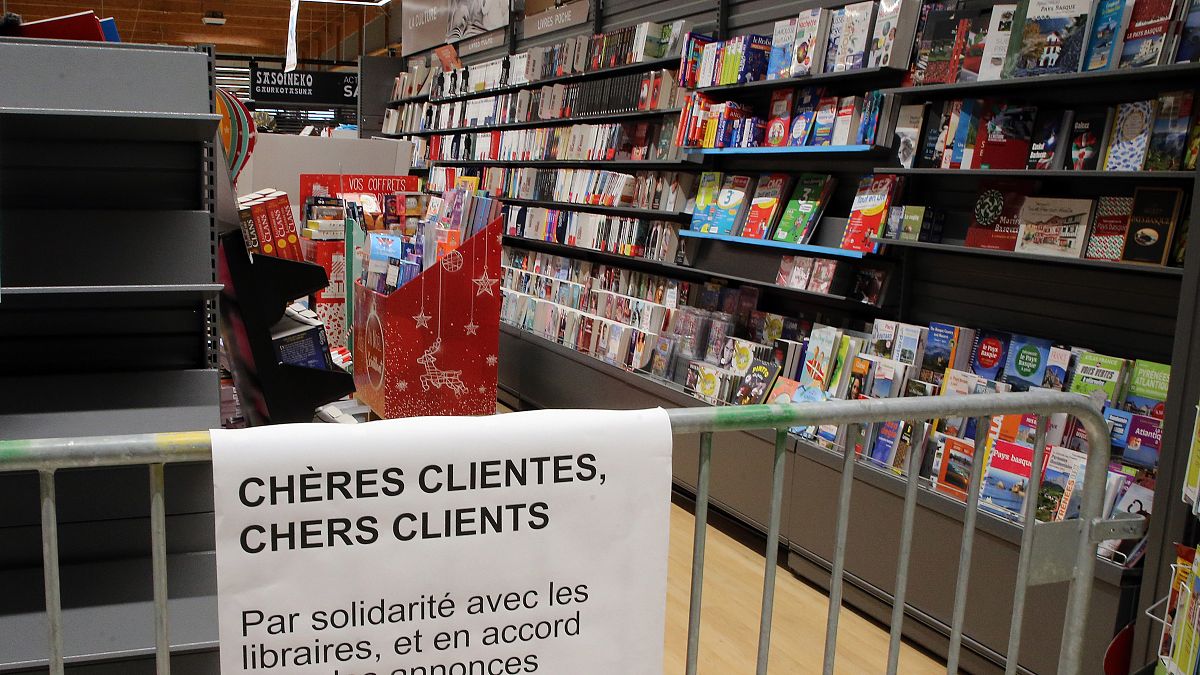 A barrier prevent customers to buy books in a supermarket of Saint Pee sur Nivelle, southwestern France, Tuesday, Nov.3, 2020. 