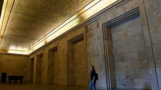 A visitor stands at the Goldener Saal (golden hall) inside the Zeppelintribuene granstand at the Zeppelinfeld (Zeppelin field)