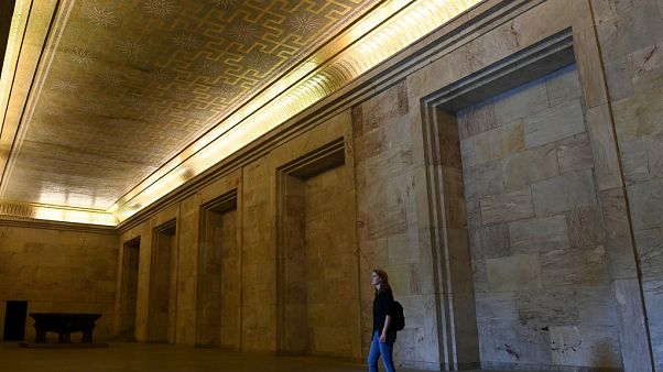 A visitor stands at the Goldener Saal (golden hall) inside the Zeppelintribuene granstand at the Zeppelinfeld (Zeppelin field) A visitor stands at the Goldener Saal (golden hall) inside the Zeppelintribuene granstand at the Zeppelinfeld (Zeppelin field)