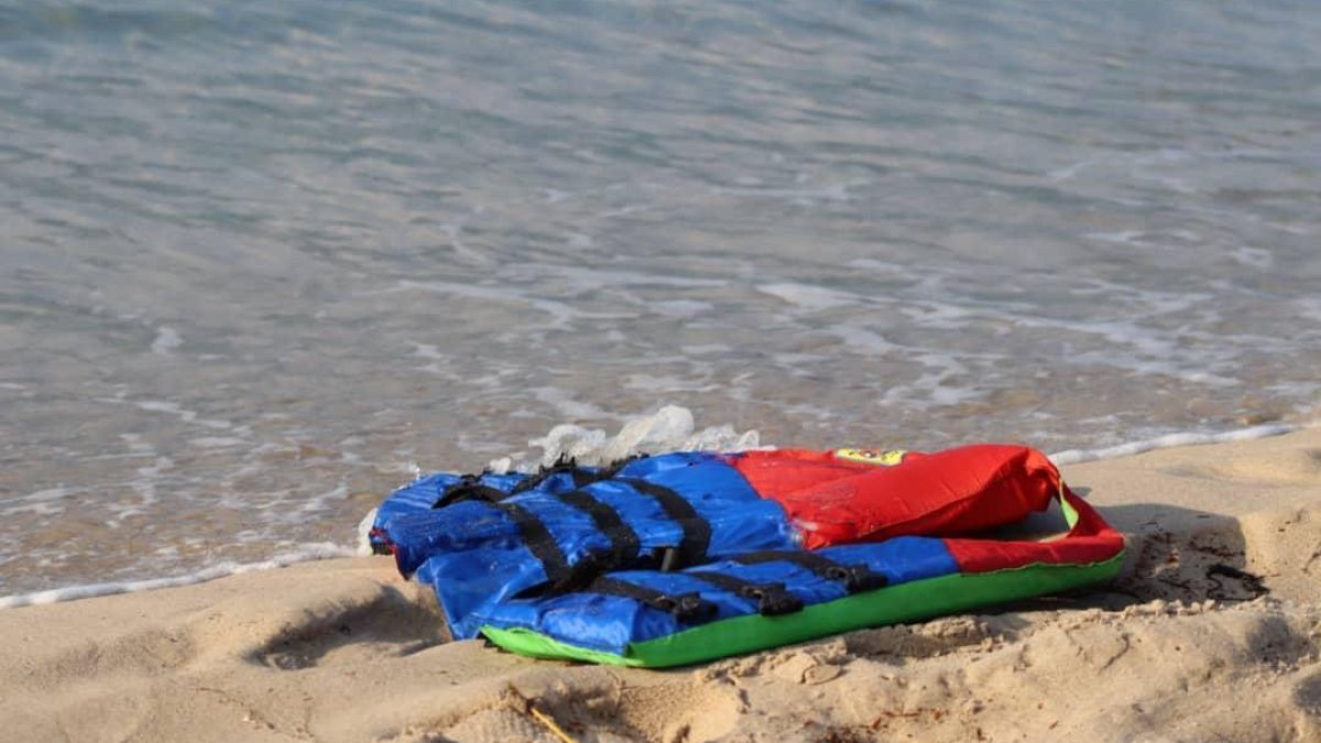 In these photos taken Nov. 12, 2020, life jackets litter the beach off the coast of Libya near the port of al-Khums. 