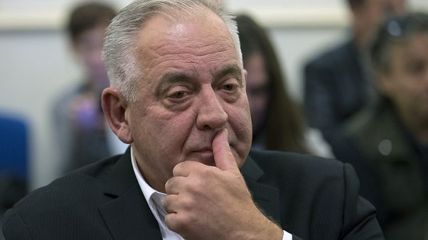In this Monday, Oct. 22, 2018 file photo, Croatia's former prime minister Ivo Sanader sits in the courtroom prior to the reading of his verdict, in Zagreb, Croatia. In this Monday, Oct. 22, 2018 file photo, Croatia's former prime minister Ivo Sanader sits in the courtroom prior to the reading of his verdict, in Zagreb, Croatia.