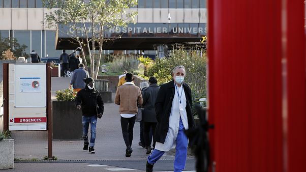 Dr Philippe Montravers arrives at the Bichat Hospital in Paris, Nov. 10, 2020. Montravers and the 150 doctors and nurses he leads have become experts on treating COVID-19. Dr Philippe Montravers arrives at the Bichat Hospital in Paris, Nov. 10, 2020. Montravers and the 150 doctors and nurses he leads have become experts on treating COVID-19.