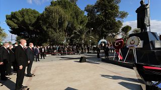 Turkish President Recep Tayyip Erdogan (front,L) and Turkish Cypriot leader Ersin Tatar (front, R) laying wreath to the statue of Mustafa Kemal Ataturk, Nicosia, Nov. 15, 2020