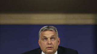 Hungarian Prime Minister Viktor Orban talks to journalists during a news conference following an European People's Party meeting at the European Parliament in Brussels, Wednes
