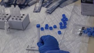 A Madrid Emergency Service (SUMMA) health workers conducts a rapid antigen test for COVID-19 in the southern neighbourhood of Vallecas in Madrid, Spain, Sept. 29, 2020