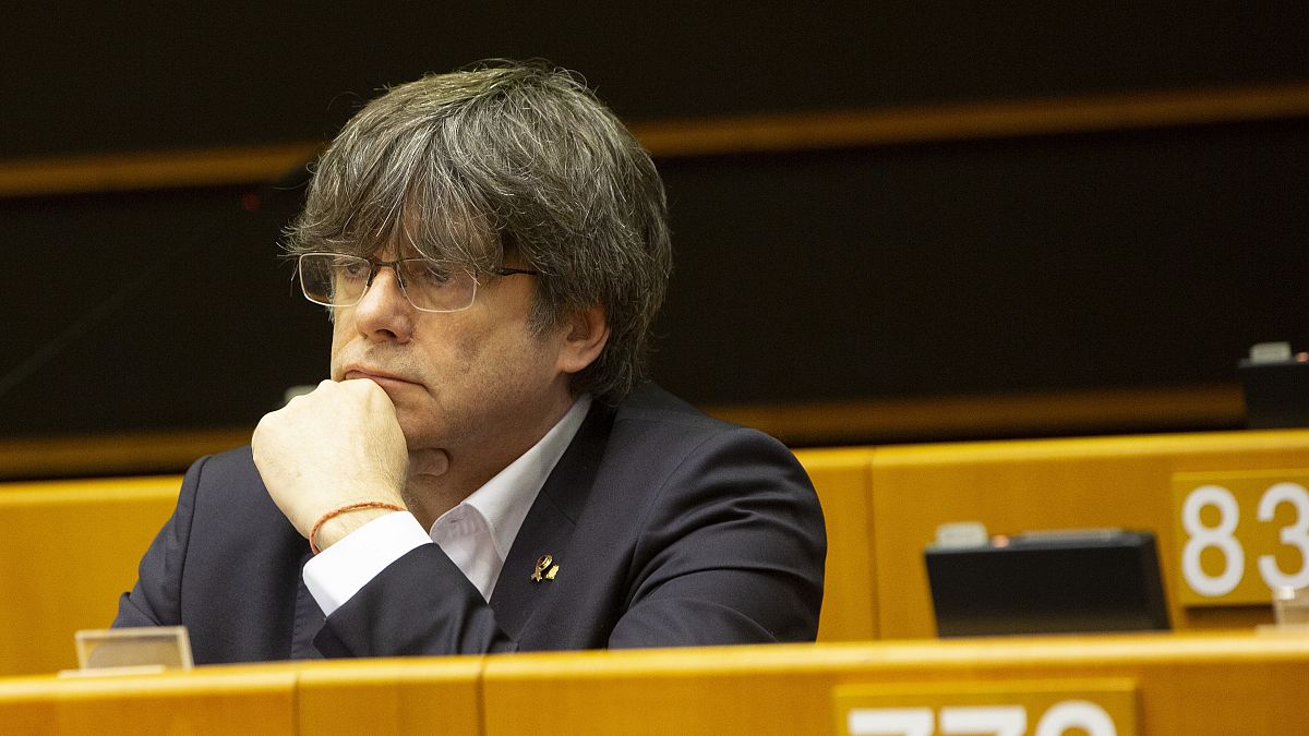 Catalonia's former regional president and MEP Carles Puigdemont listens during a session in the Plenary chamber of the European Parliament in Brussels