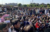 Supporters of Tehreek-e-Labaik Pakistan, a religious political party, block a main highway during an anti-France rally in Islamabad, Pakistan, Monday, Nov. 16, 2020.