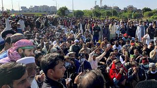 Supporters of Tehreek-e-Labaik Pakistan, a religious political party, block a main highway during an anti-France rally in Islamabad, Pakistan, Monday, Nov. 16, 2020.