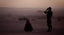 FILE - In this Feb.27, 2011 file photo, pro-independence Polisario Front rebel soldiers pray after sunset in the Western Sahara village of Tifariti.