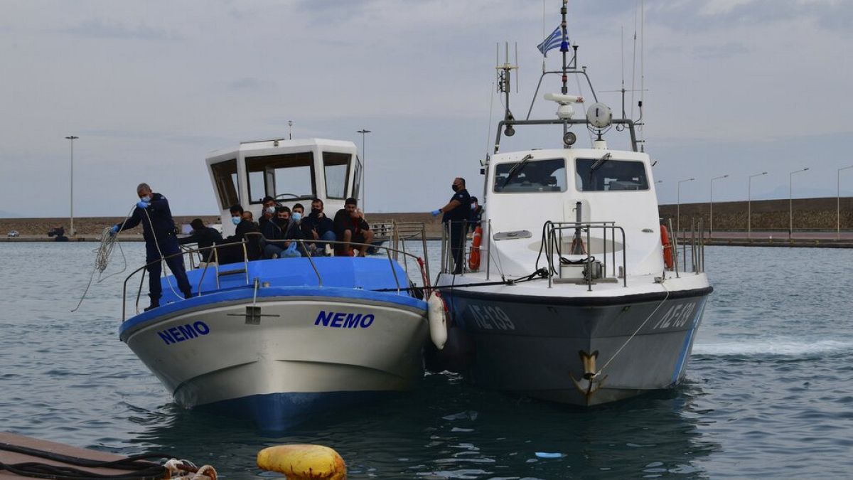 A vessel with migrants arrive after an operation by the Greek Coast guard