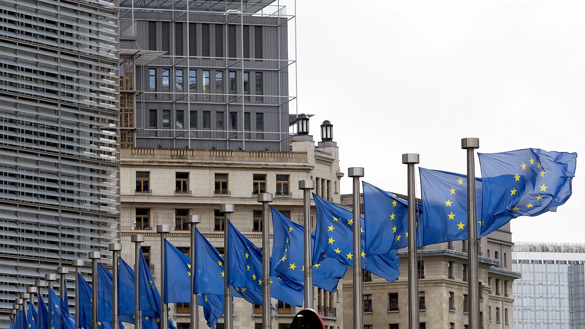 European Union flags flap in the wind at EU headquarters in Brussels, Wednesday, Oct. 9, 2019.