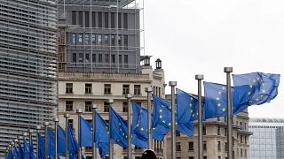 European Union flags flap in the wind at EU headquarters in Brussels, Wednesday, Oct. 9, 2019.