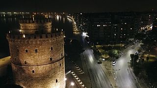 The seaside Nikis avenue is empty as the White Tower is seen foreground during a curfew in the northern city of Thessaloniki