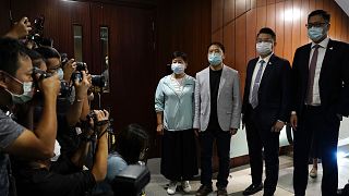 Pro-democracy legislators pose for photographers after handing their resignation letters at Legislative Council in Hong Kong on Nov. 12, 2020.