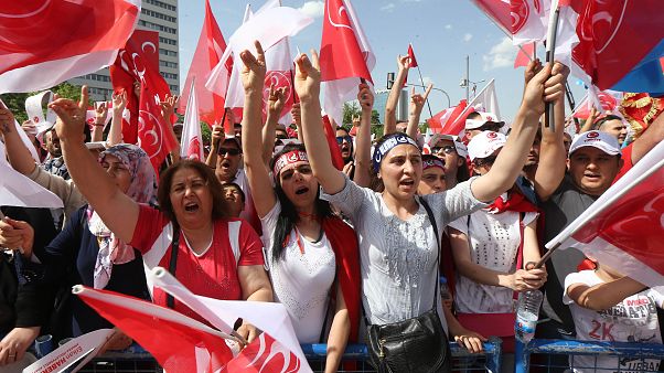 People gestures the "Grey Wolves" salutation and wave flafs during an election rally of Turkey's opposition Nationalist Action Party (MHP) May 24, 2015 in Ankara, People gestures the "Grey Wolves" salutation and wave flafs during an election rally of Turkey's opposition Nationalist Action Party (MHP) May 24, 2015 in Ankara,