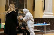 Girl getting tested for Covid-19 in a church in Naples, Italy
