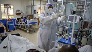 A medical worker attends to a COVID-19 patient in the intensive care unit in Machakos, south of Nairobi, in Kenya on Nov. 3, 2020. 