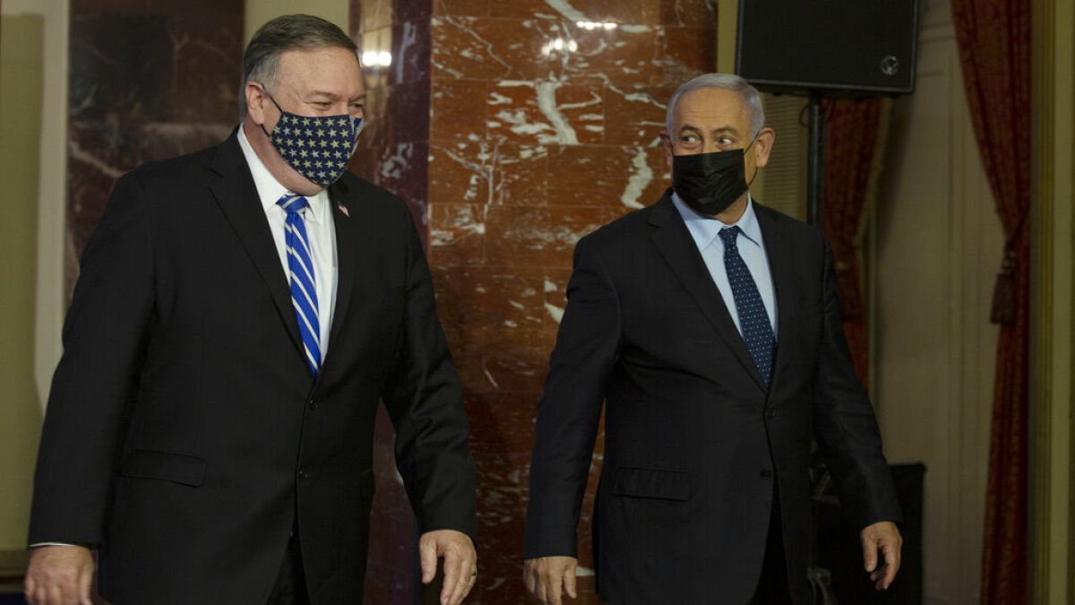US. Secretary of State Mike Pompeo, left, and Israeli Prime Minister Benjamin Netanyahu leave after making a joint statement in Jerusalem, Thursday, Nov. 19, 2020