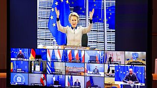 European Commission President Ursula von der Leyen, top, gestures as she talks with EU leaders during an EU Summit video conference at the European Council building.