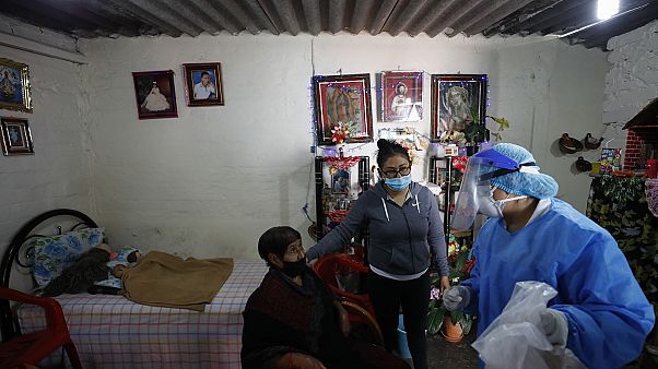 Dr Delia Caudillo, right, gives medical guidance to 82-year-old Modesta Caballero, left, after a medical team tested Caballero for COVID-19 at her home in Mexico City. Dr Delia Caudillo, right, gives medical guidance to 82-year-old Modesta Caballero, left, after a medical team tested Caballero for COVID-19 at her home in Mexico City.