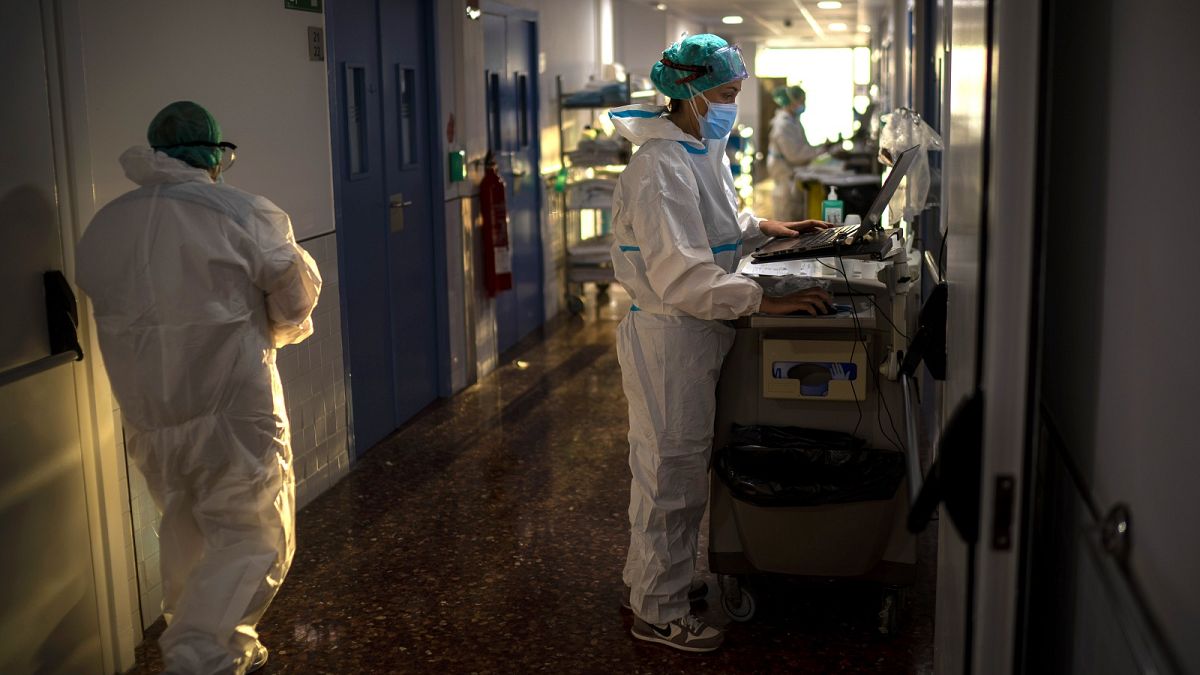 Nurse Marta Fernandez works at the COVID-19 ward at the hospital del Mar in Barcelona, Spain, Wednesday, November 18, 2020.