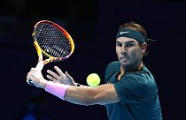 Rafael Nadal of Spain returns the ball to Stefanos Tsitsipas of Greece during their tennis match at the ATP World Finals.