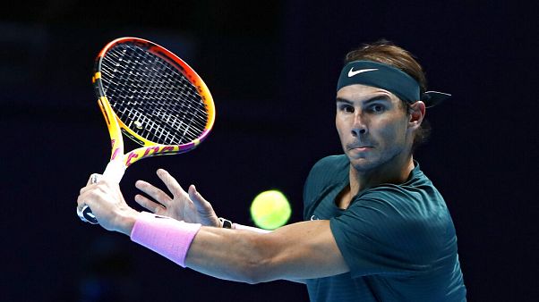 Rafael Nadal of Spain returns the ball to Stefanos Tsitsipas of Greece during their tennis match at the ATP World Finals. Rafael Nadal of Spain returns the ball to Stefanos Tsitsipas of Greece during their tennis match at the ATP World Finals.