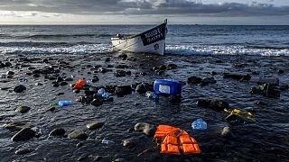 FILE: A wooden boat used by migrants from Morocco is seen at the coast of the Canary Island on Friday, Oct.16, 2020.