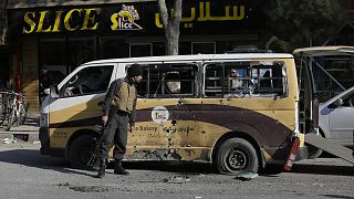 Afghan security checks a car destroyed in a rocket attack in Kabul, Afghanistan,Saturday, November 21, 2020.