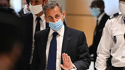 Former French president Nicolas Sarkozy arrives at the Paris court house to hear the final verdict in a corruption trial on March 1, 2021
