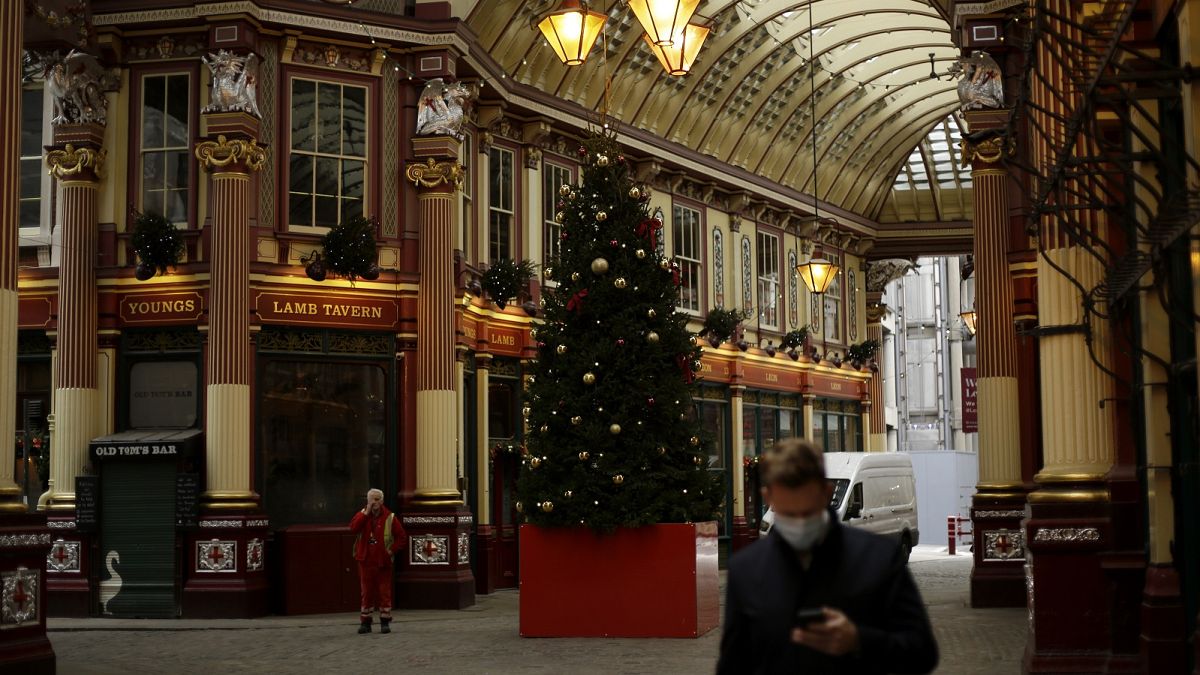 A Christmas tree stands on display in the middle of Leadenhall Market where all the non-essential shops are temporarily closed, during England's second coronavirus lockdown.