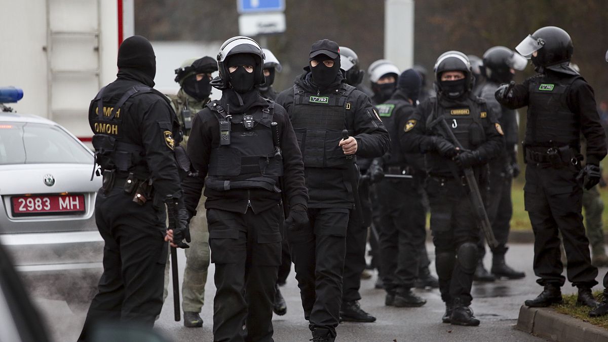 Belarusian riot police gather to block demonstrators during an opposition rally in November.