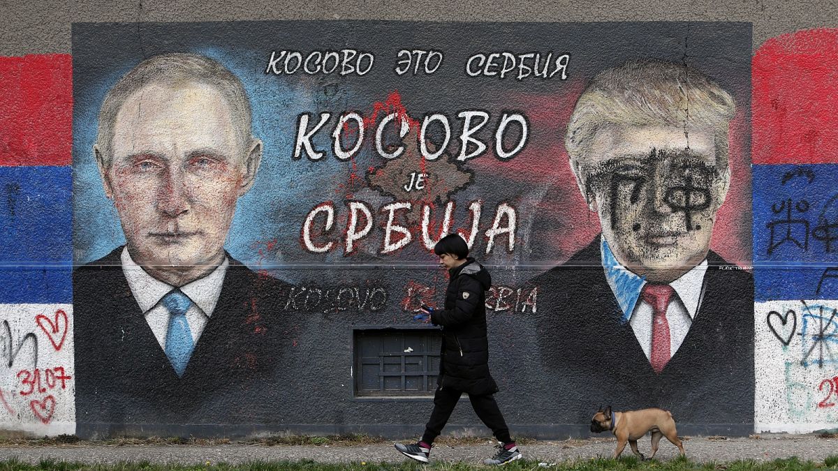A mural depicting the Russian President Vladimir Putin, left, and US President Donald Trump in a suburb of Belgrade, Serbia. The graffiti reads "Kosovo is Serbia".