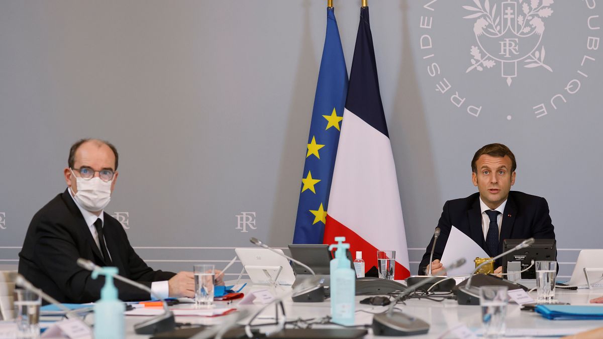 President Emmanuel Macron, right, speaks next to French Prime Minister Jean Castex, left, during a videoconference in Paris, November 17, 2020.