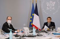 President Emmanuel Macron, right, speaks next to French Prime Minister Jean Castex, left, during a videoconference in Paris, November 17, 2020.