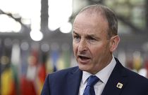 Ireland's Prime Minister Micheal Martin speaks with the media as he arrives for an EU summit in Brussels, Friday, Oct. 16, 2020.