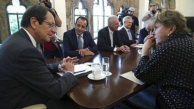 UN envoy Jane Holl Lute, right, talks with Cyprus' president Nikos Anastasiades