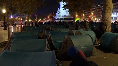 People setting up tents at Place de la République