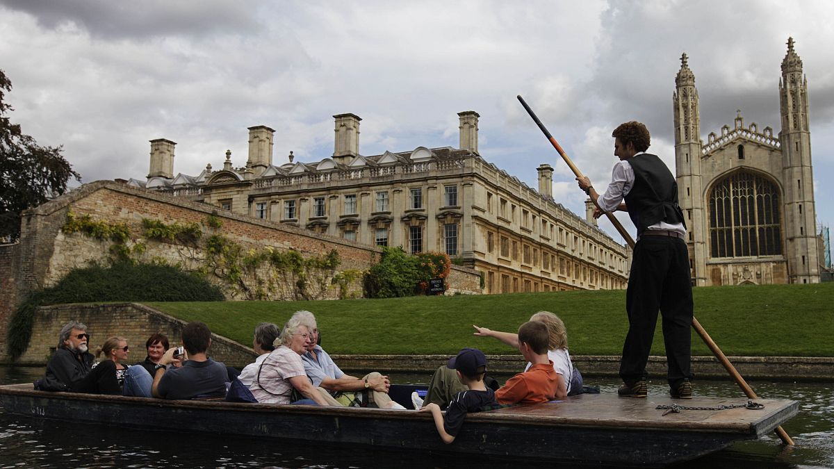 Tourists enjoy a punt on the river Cam, in Cambridge, England. 