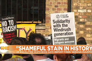 Sign reads 'Solidarity with the Windrush generation' at a demostration in London