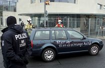 A car stand in front of the chancellery after it crashed into the front gate of the building housing German Chancellors Angela Merkel's offices in Berlin.