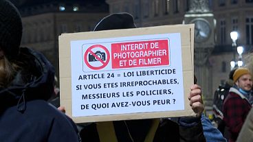 Crowd and signs against security law